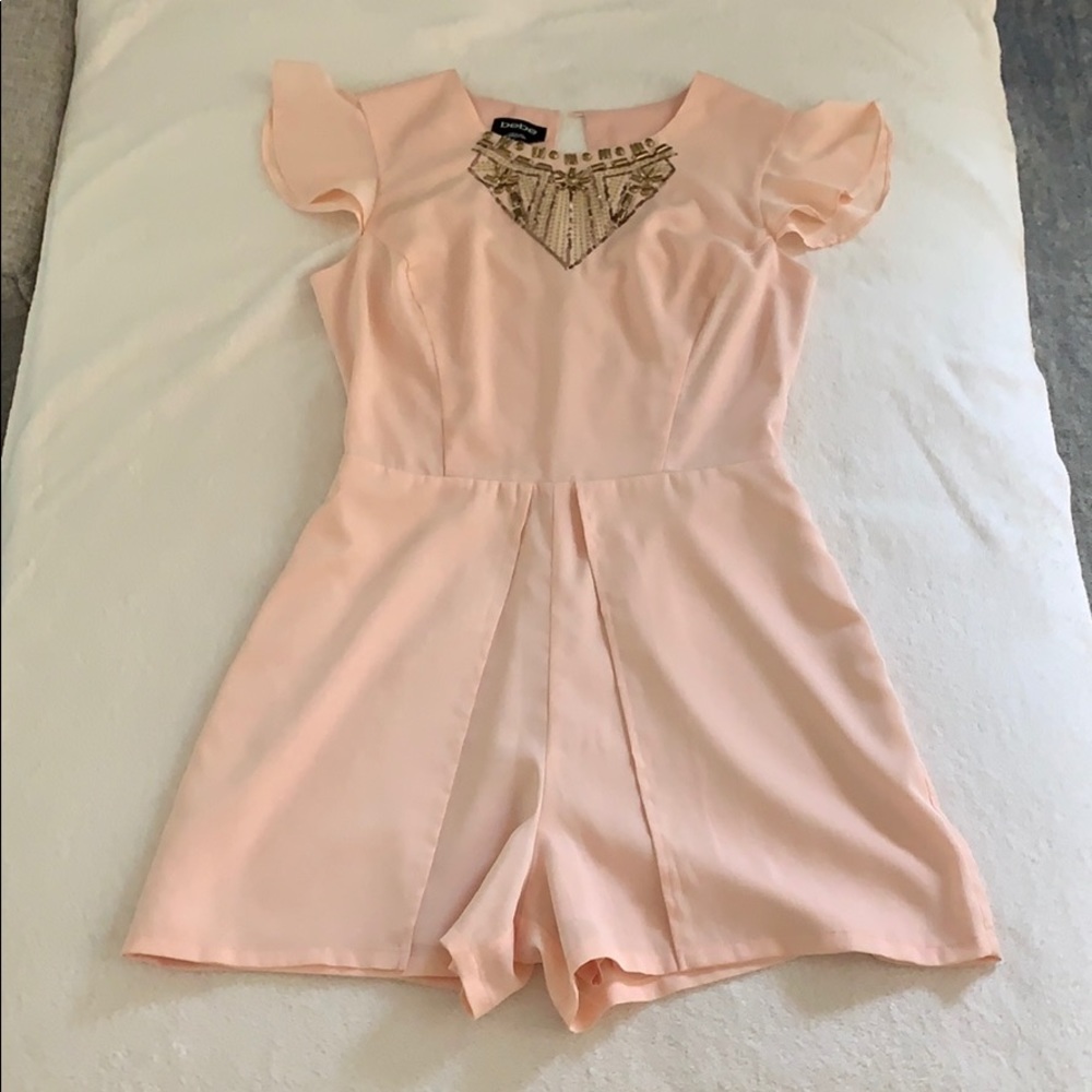Light blush romper by Bebe